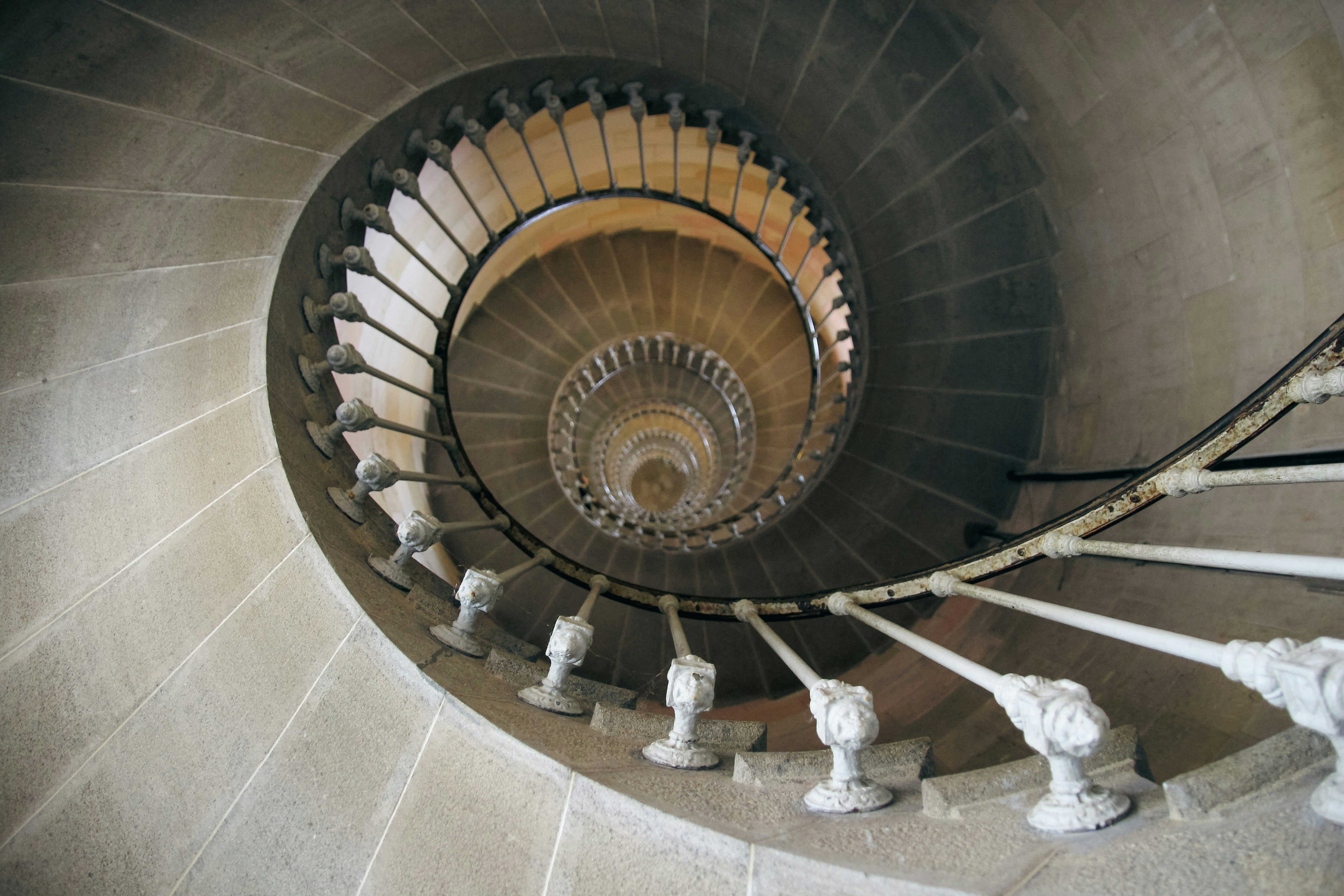 A sculptural staircase defining the architecture of an elegant interior.