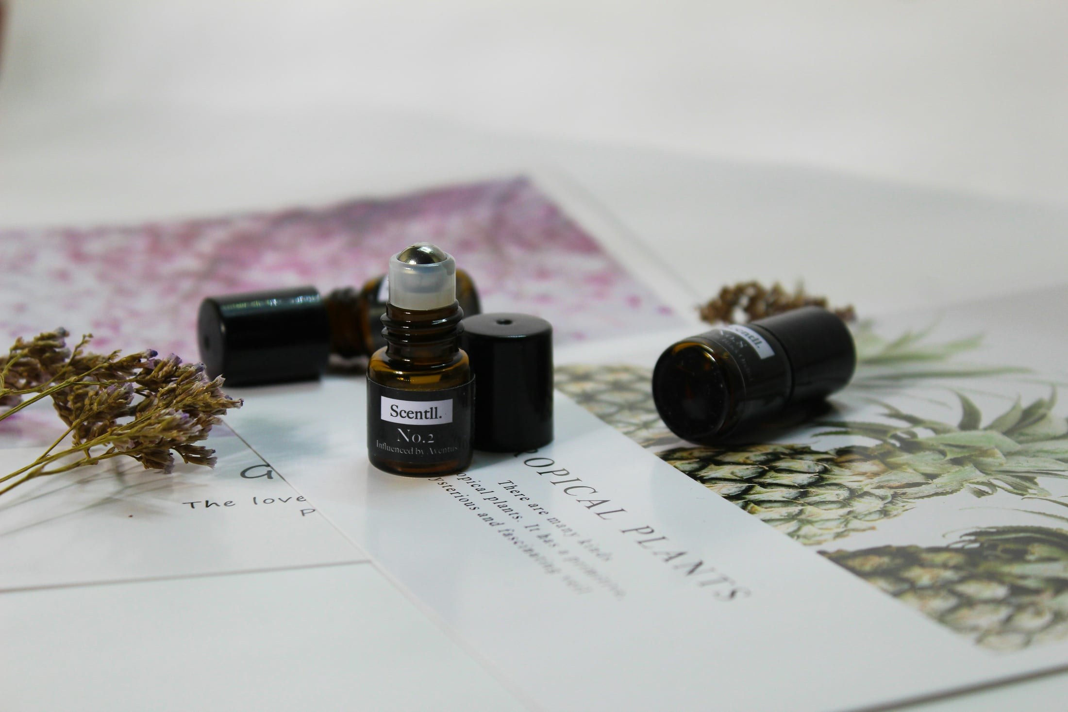 House Page Archive 3 Hands blending fragrance ingredients in an artisanal perfume-making process.